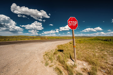 Stop sign on empty highway in Wyoming