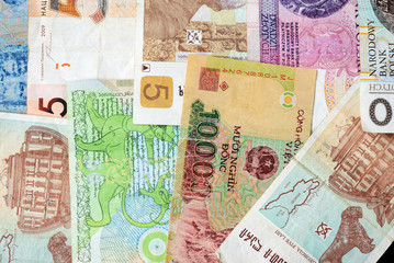 Different countries money background close up. Belarusian rubles, Georgian lari, Polish zloty, Israeli shekels, Vietnamese dongs