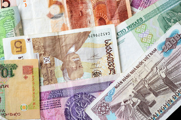 Different countries money background close up. Belarusian rubles, Georgian lari, Polish zloty,...