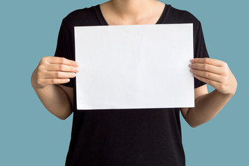 Young woman holding up copyspace Placard.Isolated on background