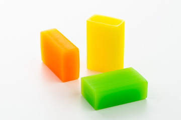Three colored eraser for erasing pencil on white background