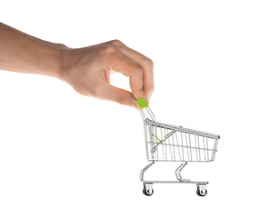 Hand holding shopping cart isolated on white clipping path
