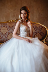Beautiful blonde bride woman in a gorgeous wedding dress, fashion beauty portrait