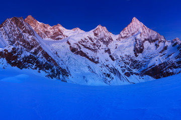 View of snow covered landscape with Dent Blanche mountains and Weisshorn mountain in the Swiss Alps...