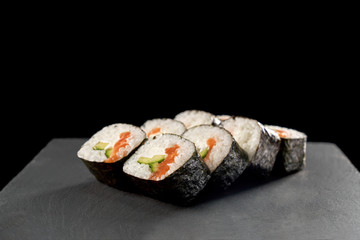 Maki sushi with cucumber and salmon.