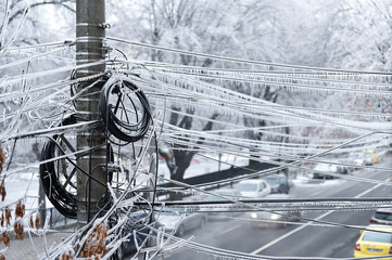 Electricity cables covered in ice after frozen rain phenomenon