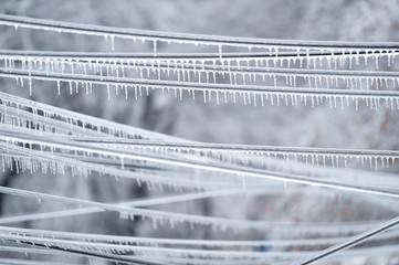 Electricity cables covered in ice after frozen rain phenomenon