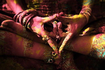 closeup of colorful woman hand in mudra gesture practice yoga outdoor