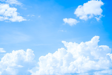 Naklejka na ściany i meble Clouds blue sky flying of white fluffy in daytime on clear summer day