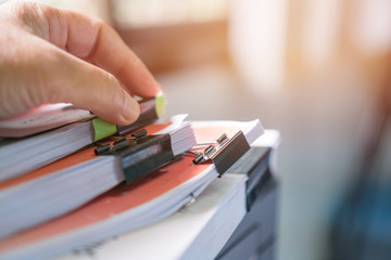 Stacks of papers documents files information business report paper with sticky notes, Businessman...