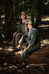 woman soldier in cottage with forest background