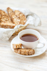 Biscotti on a light background. Tasty breakfast. Selective focus.