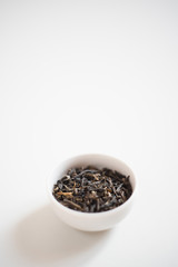 chinese tea in a  drinking bowl on white background 