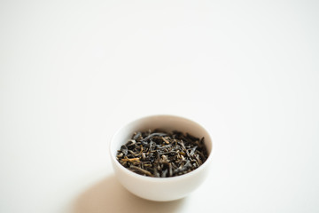 chinese tea in a  drinking bowl on white background 