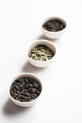 the white drinking bowls of chinese tea in order  on white background