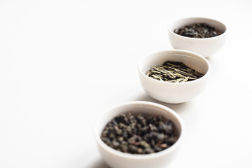 the white drinking bowls of chinese tea in order  on white background