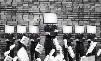 Businessmen with TV instead of head.