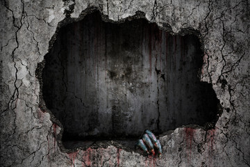 Hand of devil has stains and drops of blood and holding the damaged grungy crack and broken...