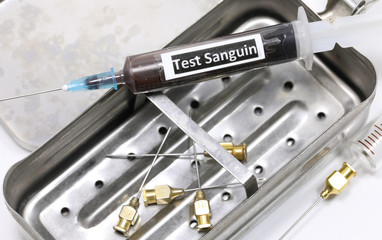 syringe with text TEST SANGUIN that means Blood Test in french l
