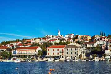 Boats and sailboats in the marina in the city of Seget Vranjica in Croatia.