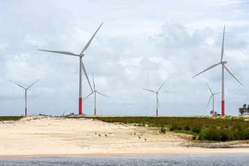 Windmills on the sand dunes of Lencois Maranhenses near Atins, Brazil