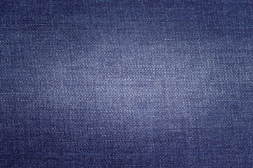 Fototapeta na wymiar Texture of blue denim fabric. Fabric for sewing jeans_