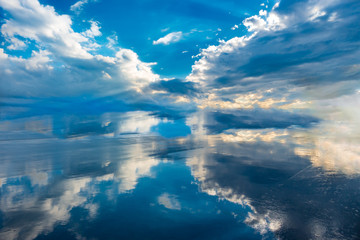 blue sky and clouds reflection