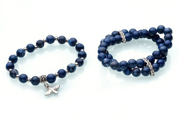 Necklaces, beads, handmade bracelets are made of artificial stone of different breeds.