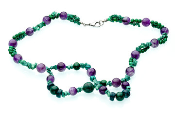 Necklaces, beads, handmade bracelets are made of artificial stone of different breeds.
