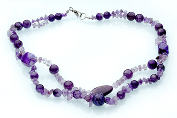 Necklaces, beads, handmade bracelets are made of artificial stone of different breeds.