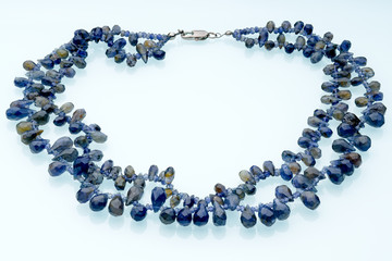 Necklaces, beads, handmade bracelets are made of artificial stone of different breeds.