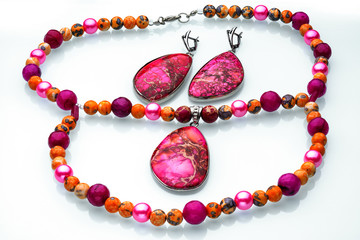 Necklaces, beads, handmade bracelets are made of artificial stone of different breeds.