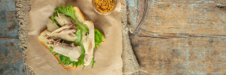 sandwich with chicken and lettuce. food background. copy space