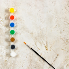 Flatlay with bright paints and brush on grey cement background, Artist, drawing, Hobby, Art