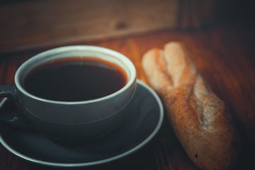 Coffee. Glass coffee cup on wooden background. vintage style