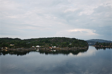 Fototapeta premium Entrance of the harbor of Bergen in Norway on a cold early summer morning