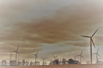 wind turbines at sunset