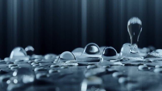 Slow motion abstract shot of beautiful surreal water drops falling down