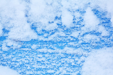 colorful background with flakes of snow and snowflakes