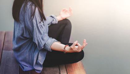 Young Woman Practices Yoga in Outdoor. Sitting in Lotus Position. Unplugged Life and Mental Health...