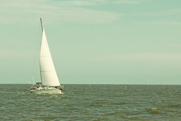 Obraz premium Lonely Sailboat Yacht at sea.