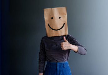 Customer Experience or Human Emotional Concept. Woman Covered her Face by Paper Bag and present...