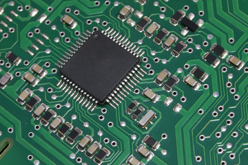 microchip and many transistors  of an electronic board photograp