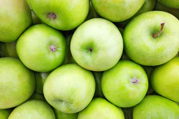 Juicy green apple background. Close up top view photography