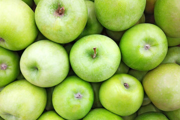 Juicy green apple background. Close up top view photography