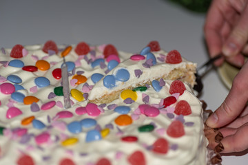 birthday cake with cream and lots of candy