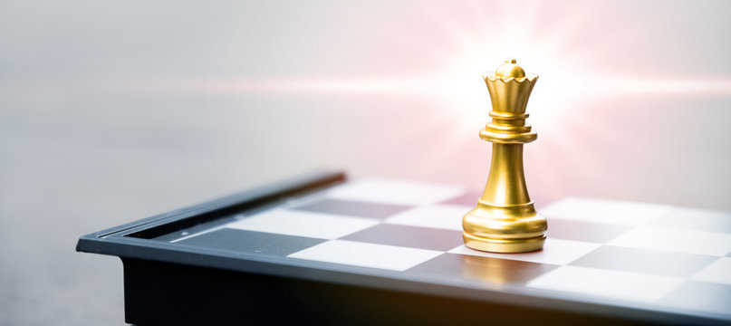 gold queen chess on board, business strategy concept