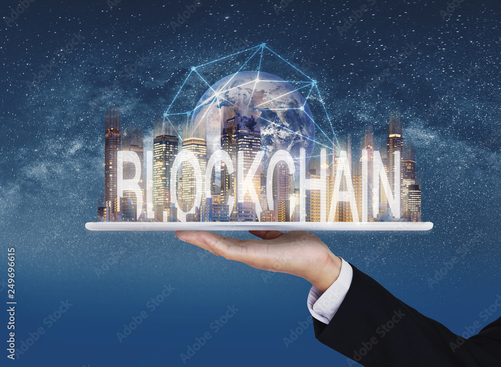 Poster blockchain business and technology, hand holding digital tablet with buildings and blockchain techno