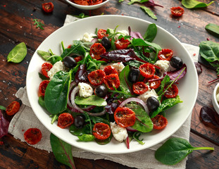 Sun dried tomatoes Salad with fresh vegetables mix and mozzarella cheese. healthy food