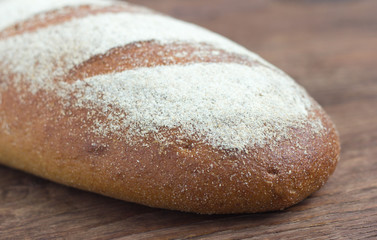 gray rustic bread on the table, close-up